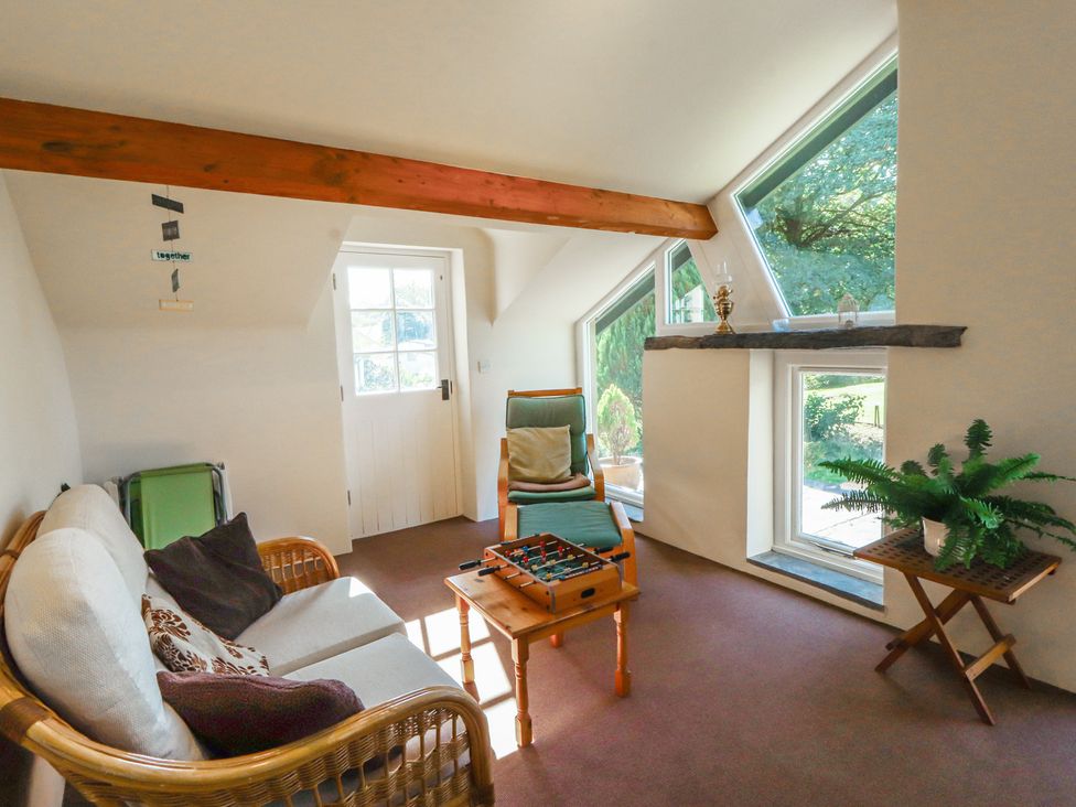 A snug with seating and a board game at Hawkshead Hall in Hawkshead