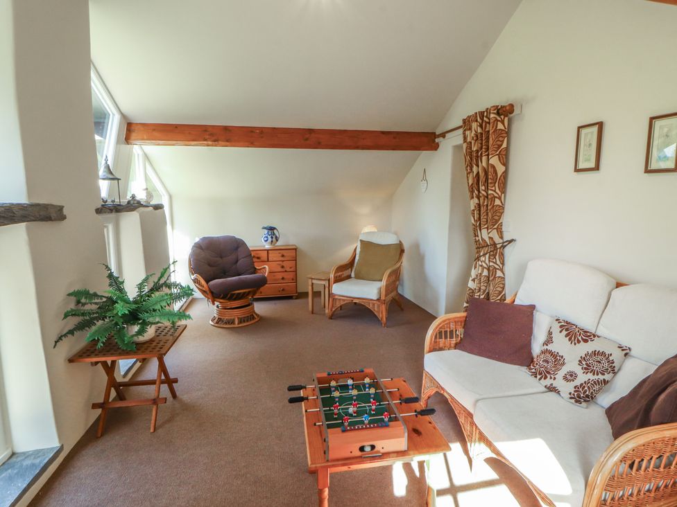 A living room with a sofa and coffee table at Hawkshead Hall in Hawkshead