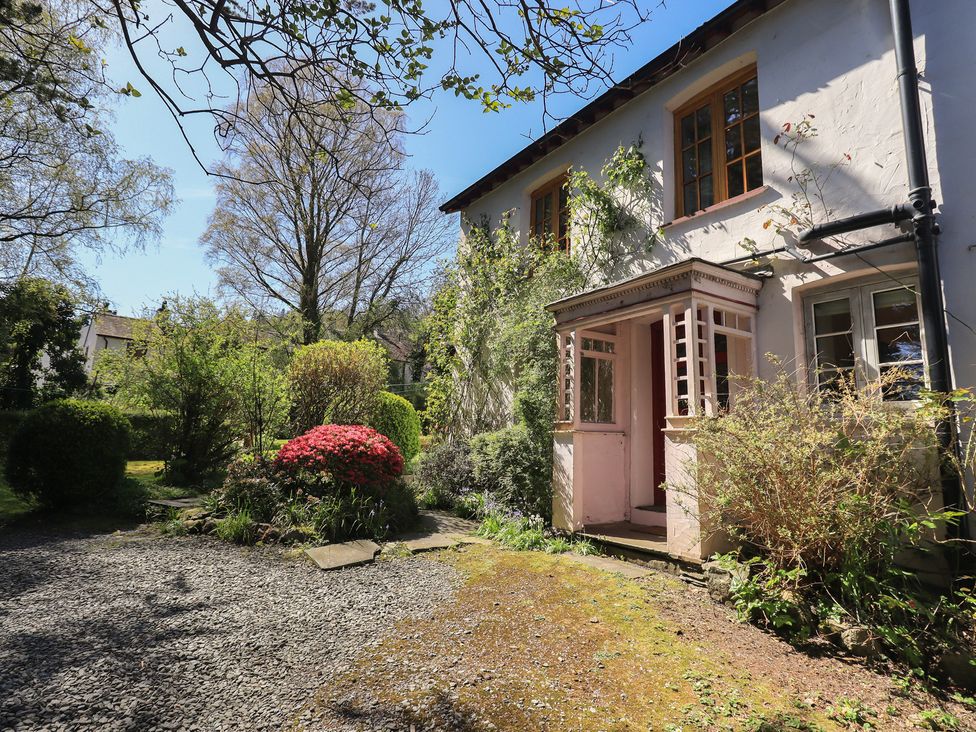 A house with a garden and pathway at Rose Cottage Coniston
