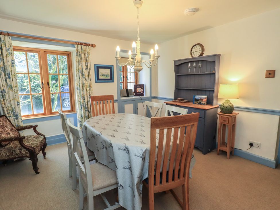 A dining room with table and chairs at Rose Cottage Coniston