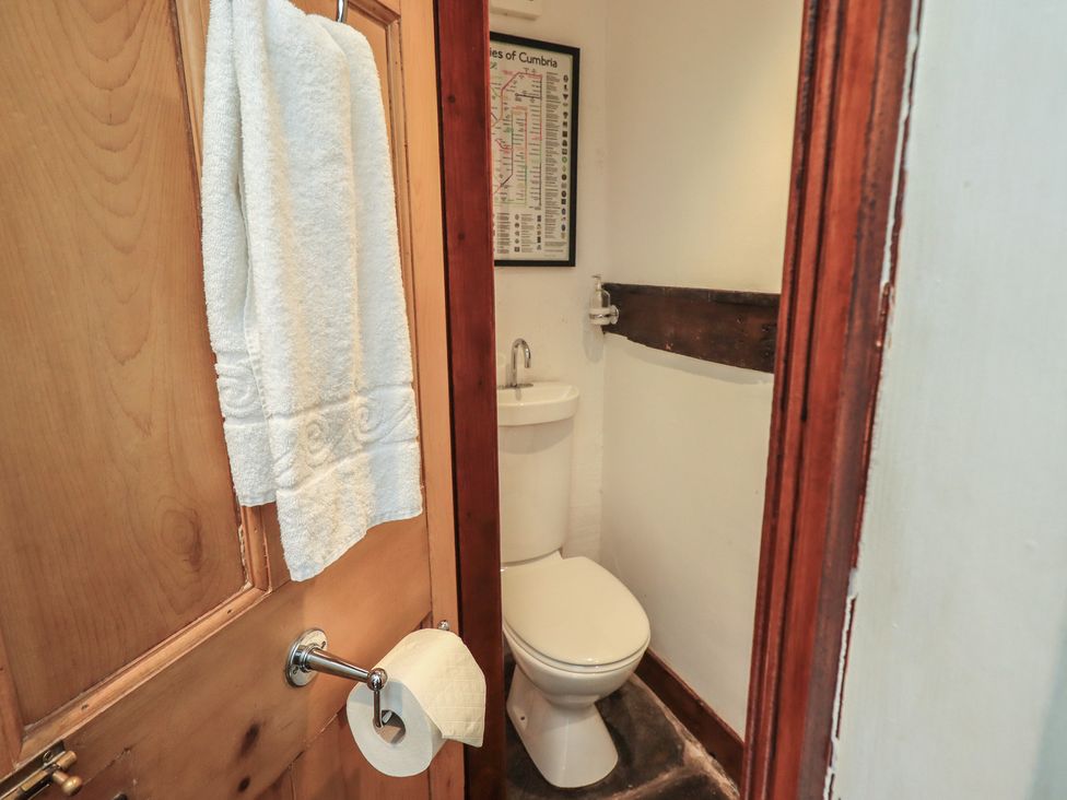 A bathroom with a toilet and sink at Rose Cottage Coniston in coniston