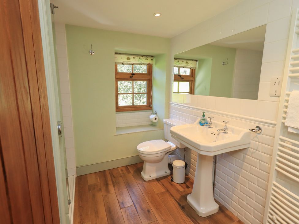 A bathroom with a sink and toilet at Rose Cottage Coniston
