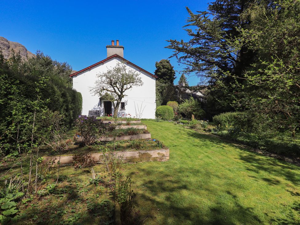 A house with a garden and steps at Rose Cottage Coniston in coniston