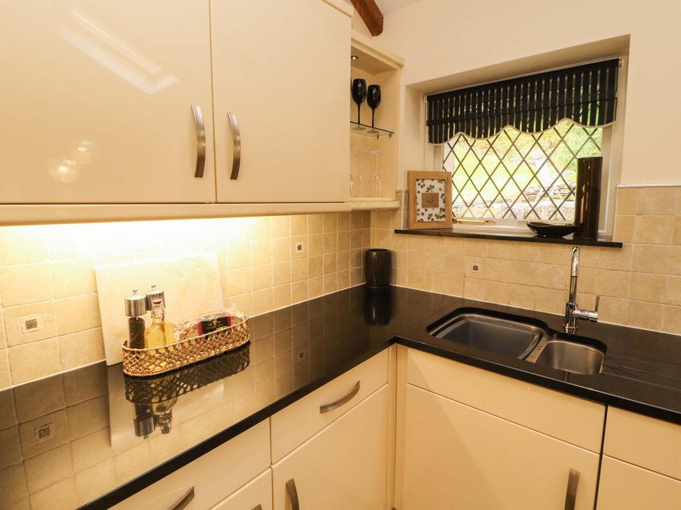 A kitchen with countertop and sink at Durham Bridge Barn in Crosthwaite