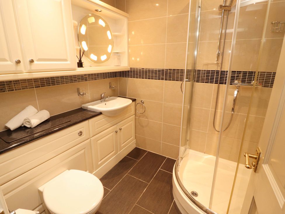 A bathroom with a sink and shower at Durham Bridge Barn in Crosthwaite