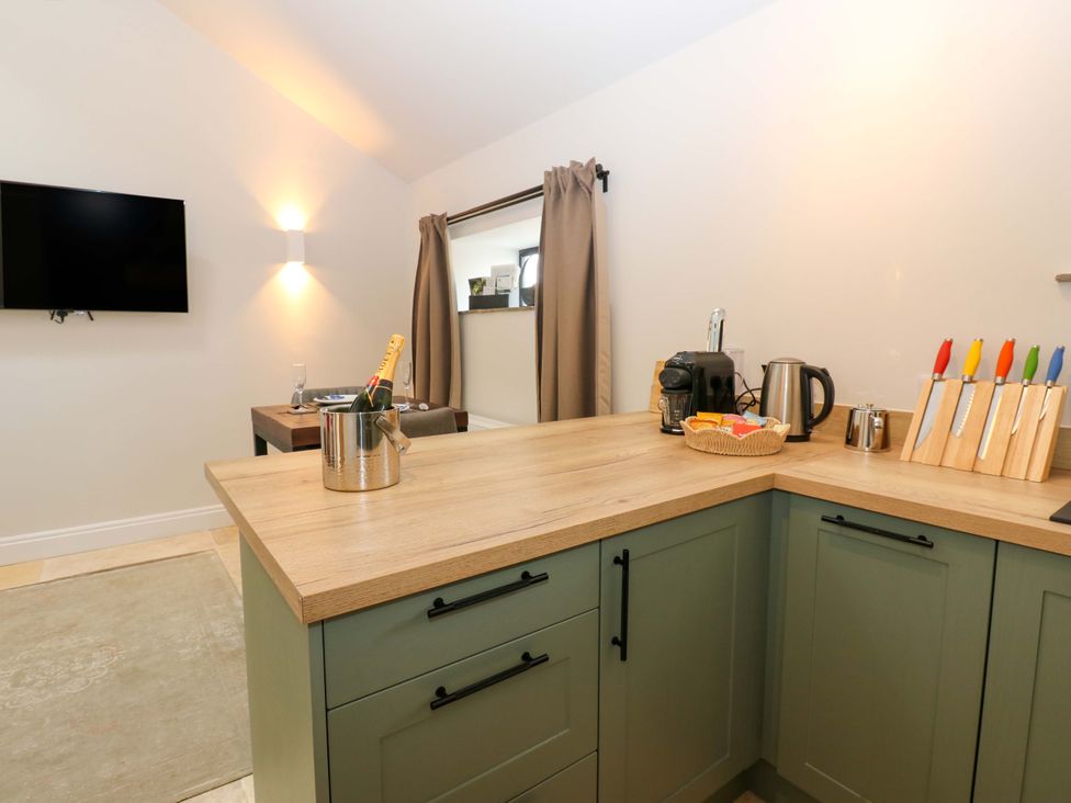 A kitchen with a television and countertop items at Hadrian Barn 1 in Ebchester