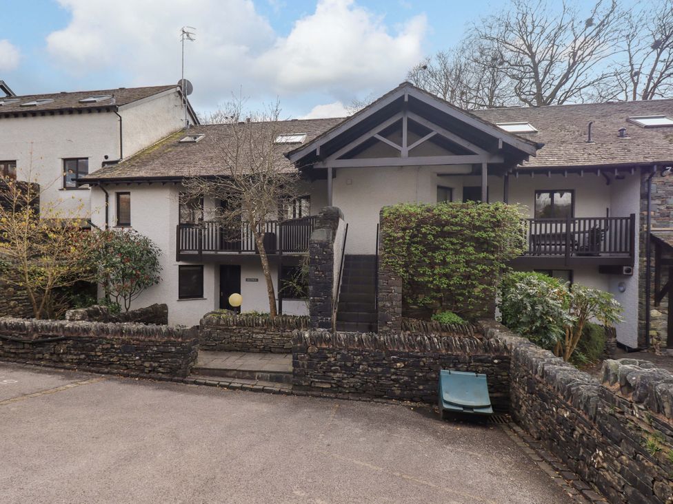 An outdoor view of a building with steps and trees at Gillybeck in Ambleside