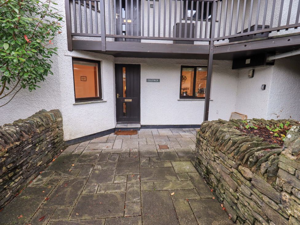 An entrance area with a door and sign at Gillybeck in Ambleside