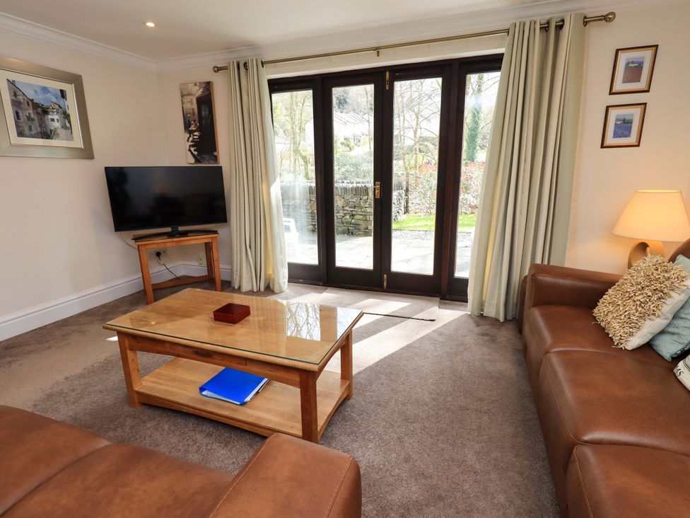 A living room with a sofa and television at Gillybeck in Ambleside
