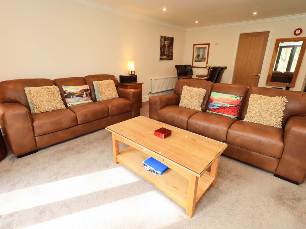 A living room with sofas and a coffee table at Gillybeck in Ambleside