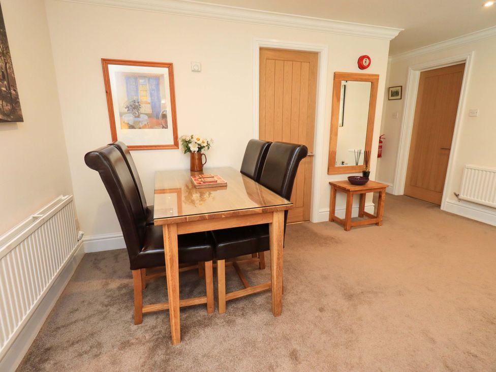 A dining room with a table and chairs at Gillybeck Ambleside