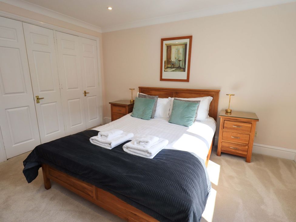 A bedroom with a bed and bedside table at Gillybeck in Ambleside