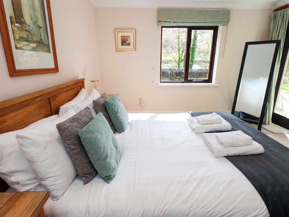 A bedroom with a bed and window at Gillybeck Ambleside