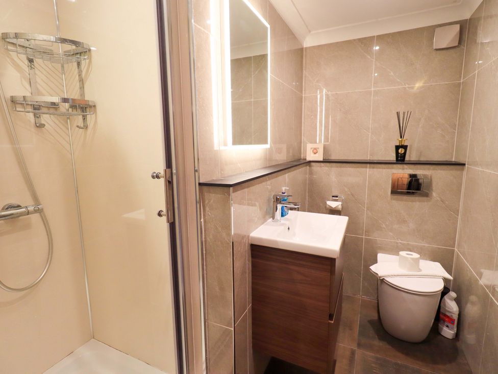 A bathroom with shower and sink at Gillybeck in Ambleside