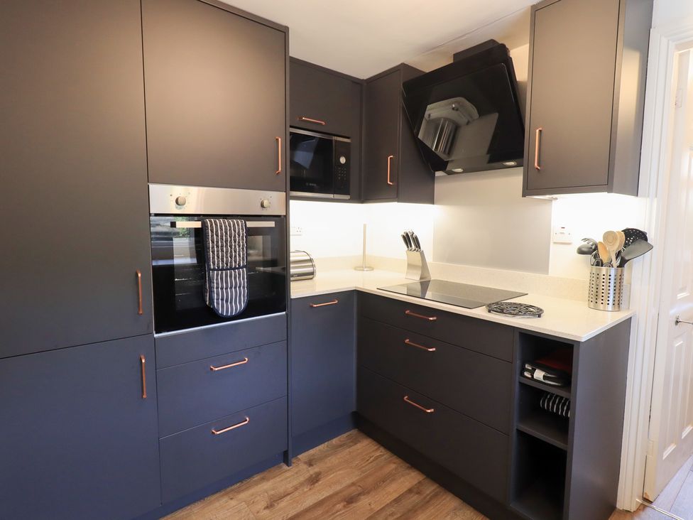 A kitchen with cabinets and appliances at Mardale in Ambleside