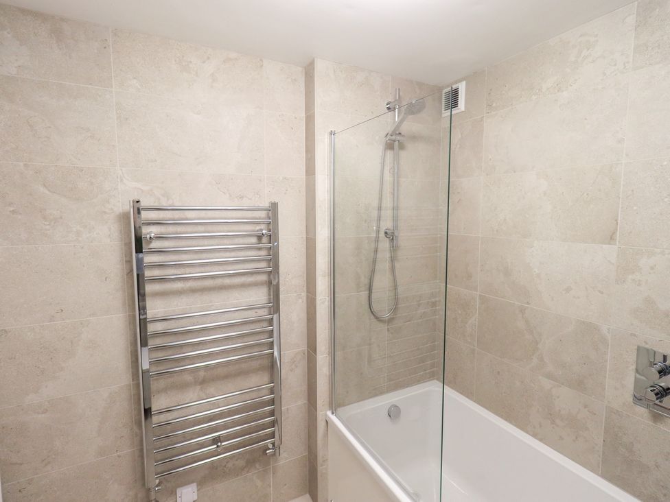 A bathroom with a bathtub and shower at Mardale in Ambleside