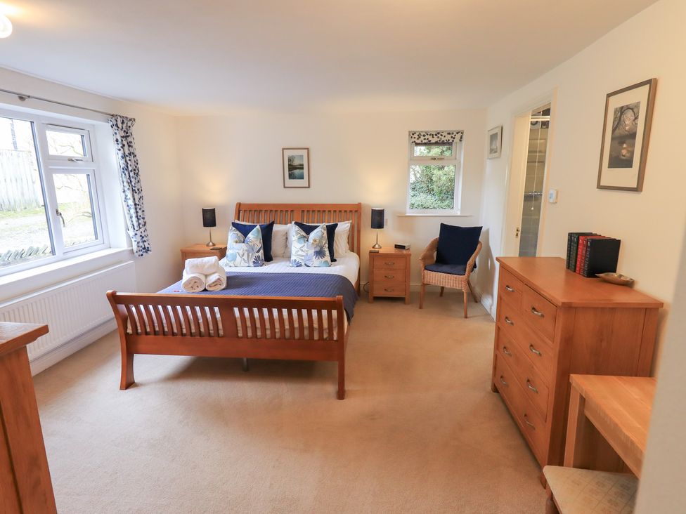 A bedroom with a bed and furniture at Mardale in Ambleside