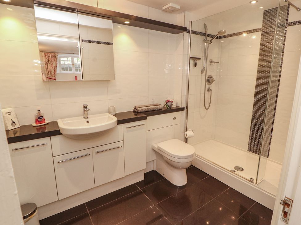 A bathroom with a shower and sink at South View in Keswick