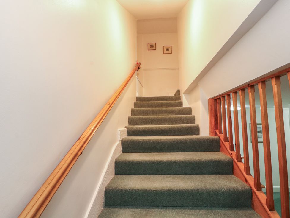 A staircase leading to the upper floor at South View in Keswick
