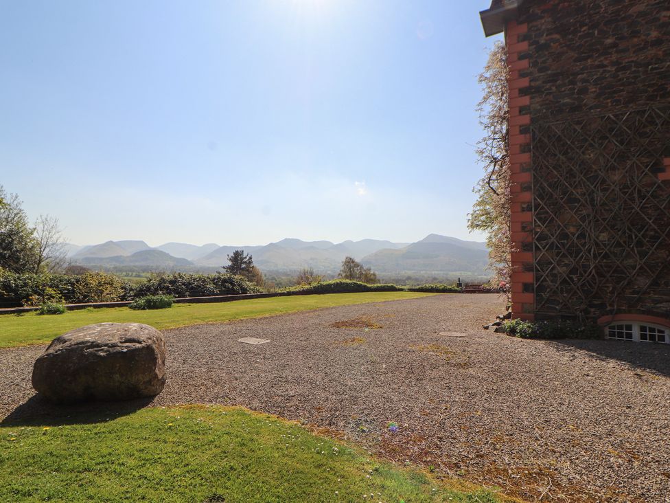 An outdoor area with a rock and view of mountains at South View in Keswick