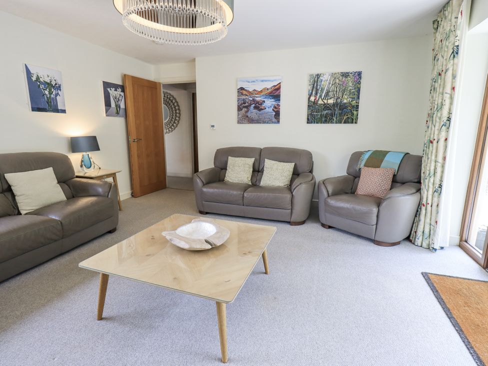 A living room with a coffee table and sofas at No 7 in Ambleside