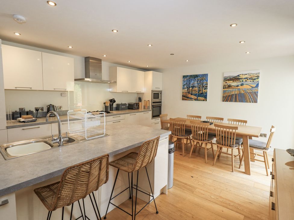 A kitchen with dining table and chairs at No 7 in Ambleside
