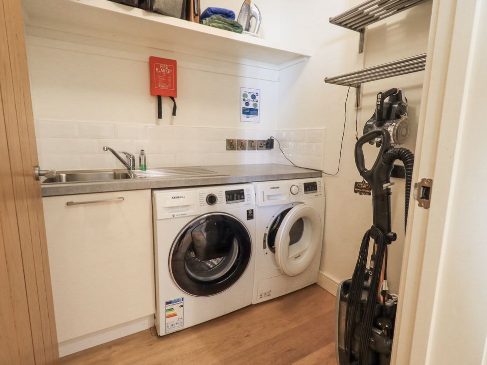 A laundry room with washing machine and dryer at No 7 in Ambleside