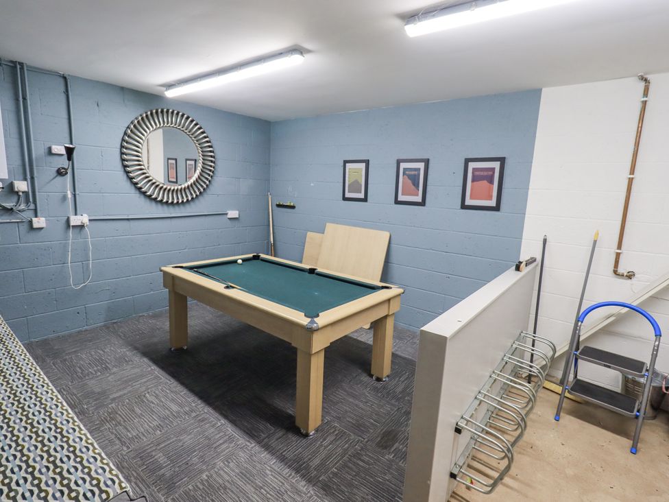 A games room with a pool table and framed pictures at No 7 in Ambleside
