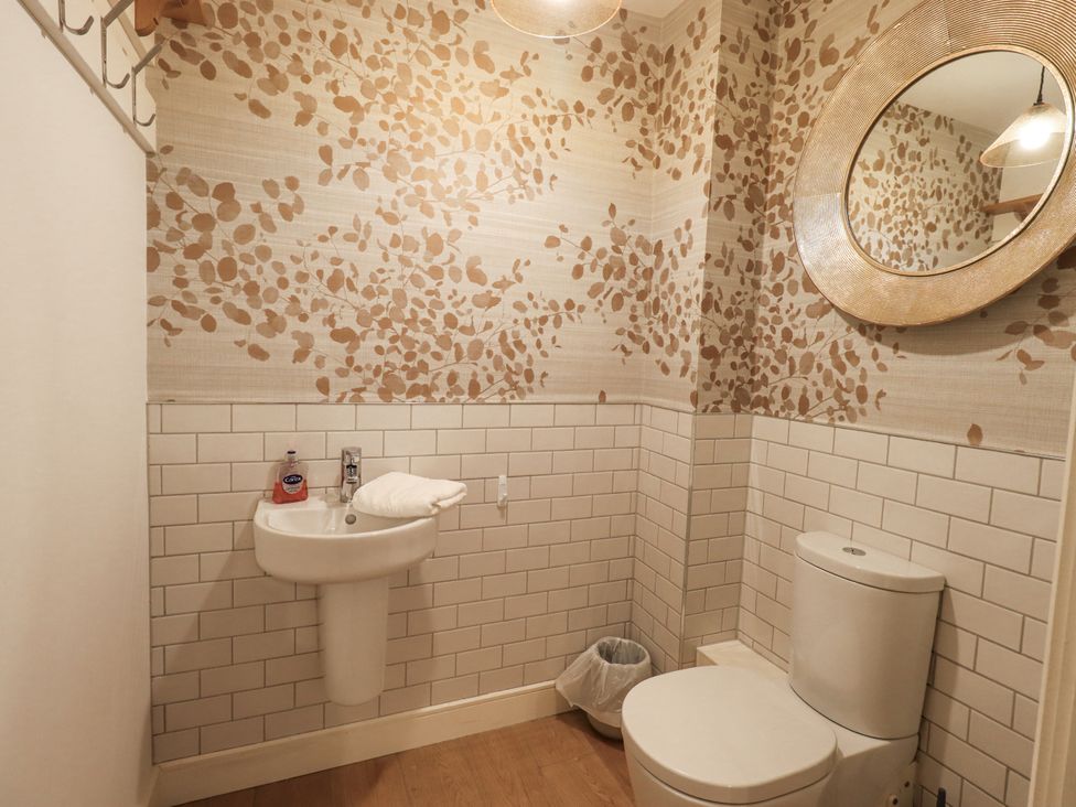A bathroom with a sink and toilet at No 7 Ambleside