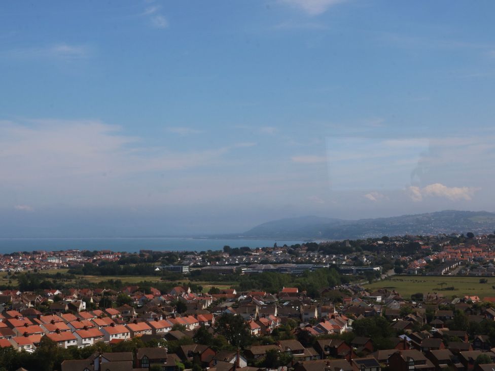 A view of houses and sea from a distance at Sea View in Llandudno