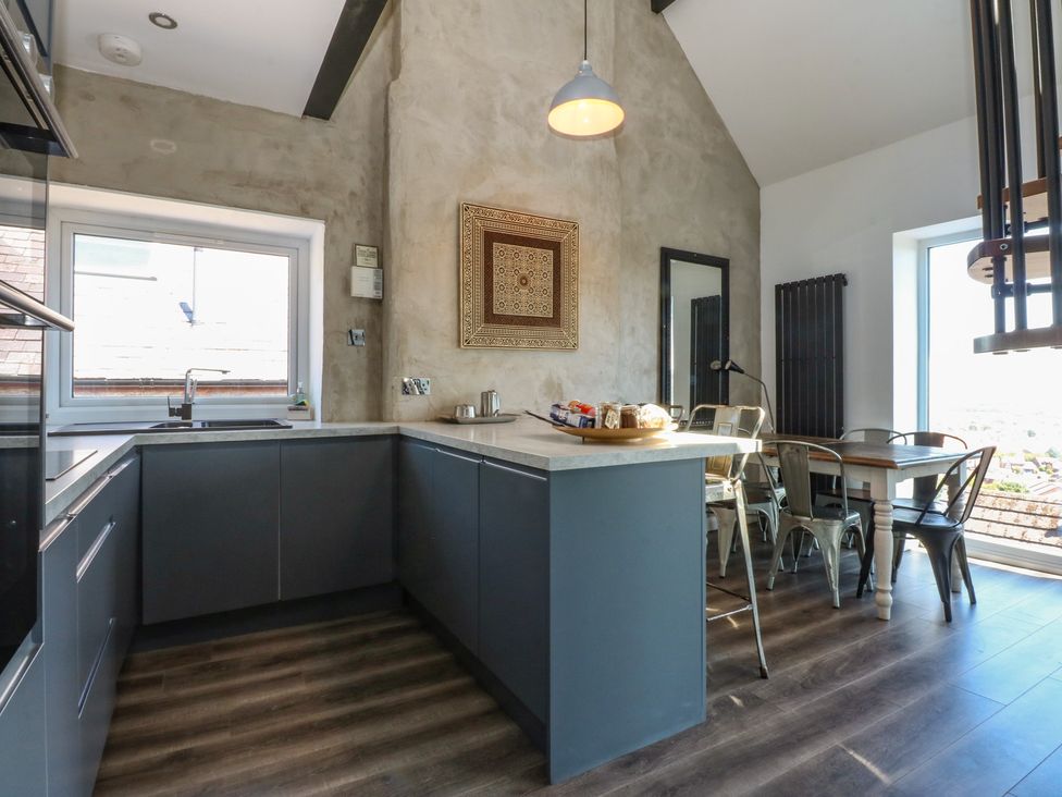 A kitchen with a sink and countertop at Sea View in Llandudno