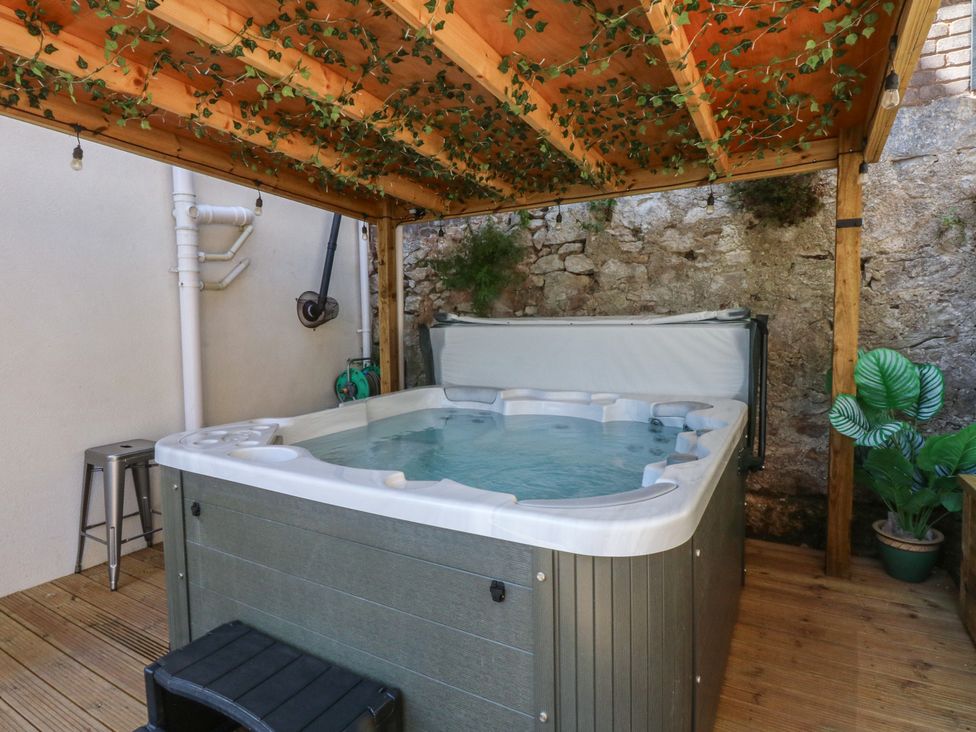 An outdoor area with a hot tub and plants at Sea View in Llandudno