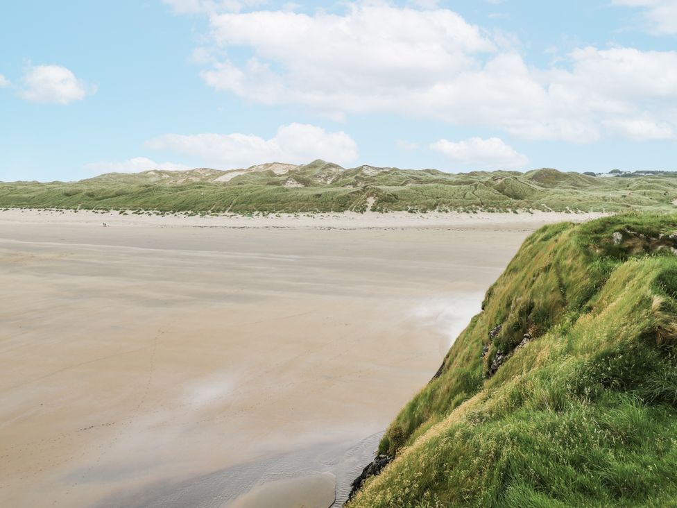 A beach with sand and grassy dunes at Brow O' The Hill in Ballyshannon