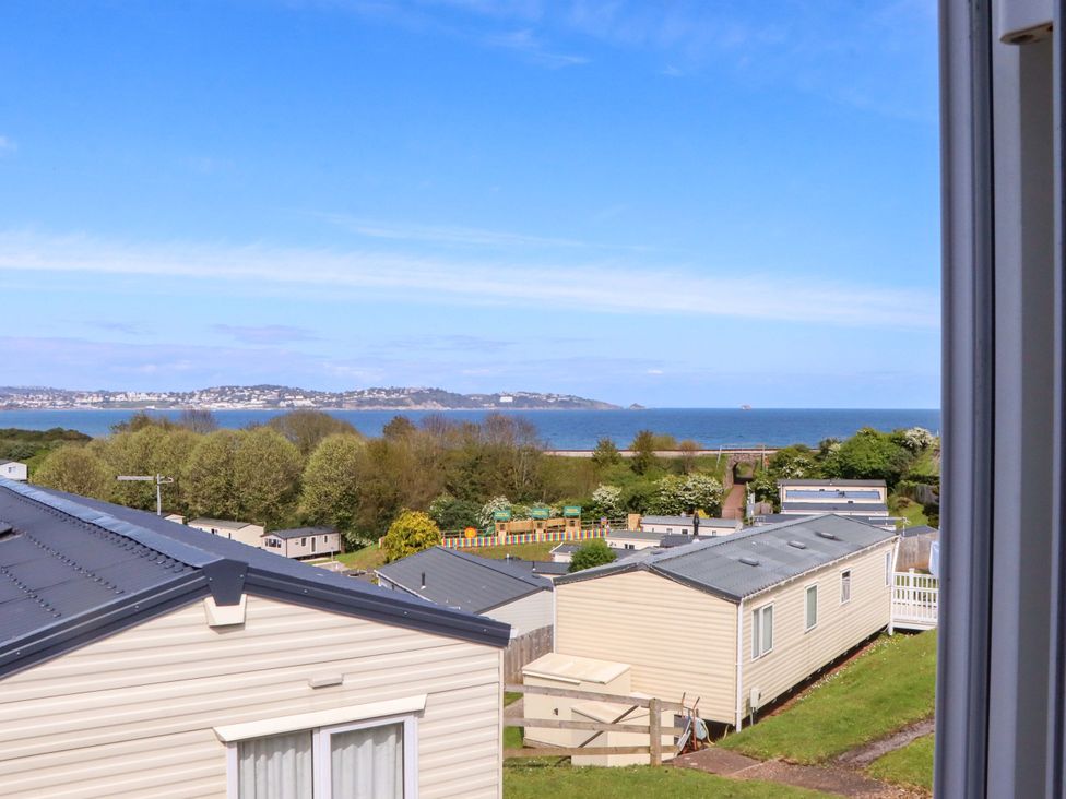 View of caravans and the sea from a height at 213 Seaview Caravan