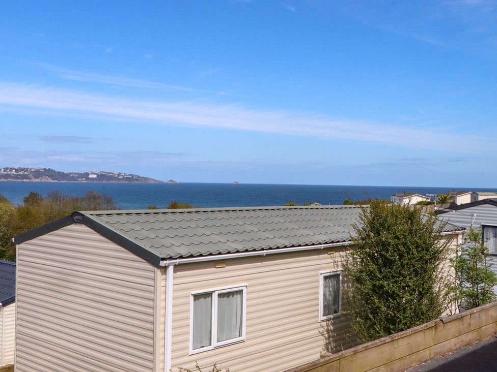 A view of caravans and the ocean at 213 Seaview Caravan