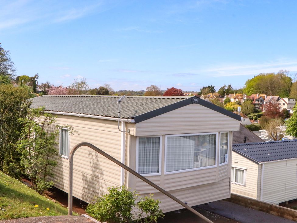 A caravan located on a slope with bushes and other caravans at 213 Seaview Caravan 