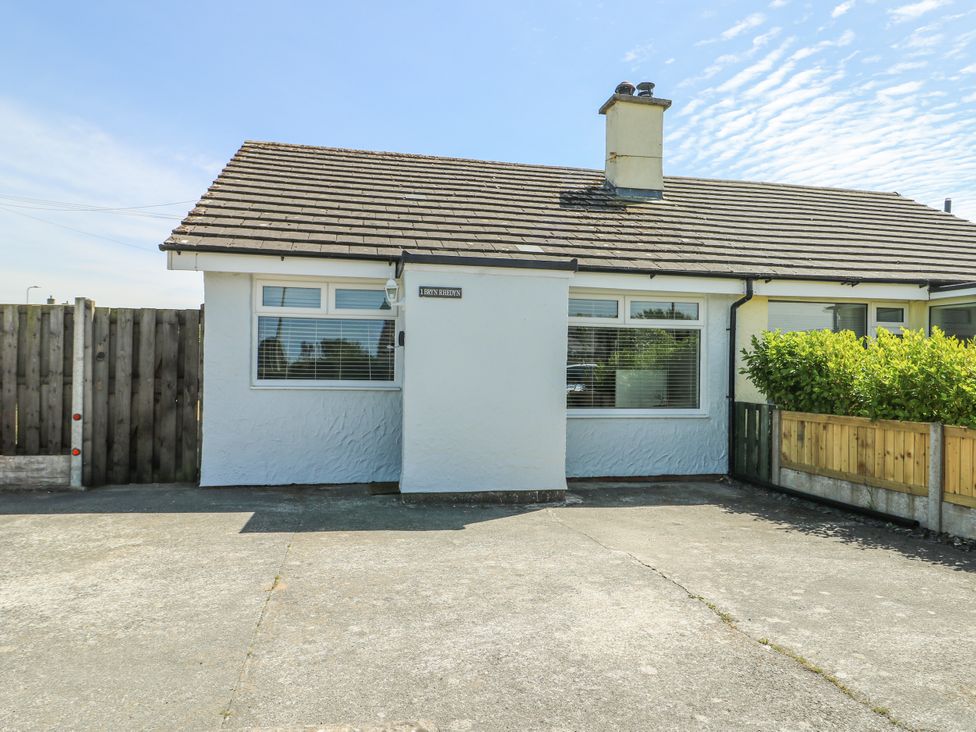 A bungalow with a parking area at Fern Hill Cottage Newborough