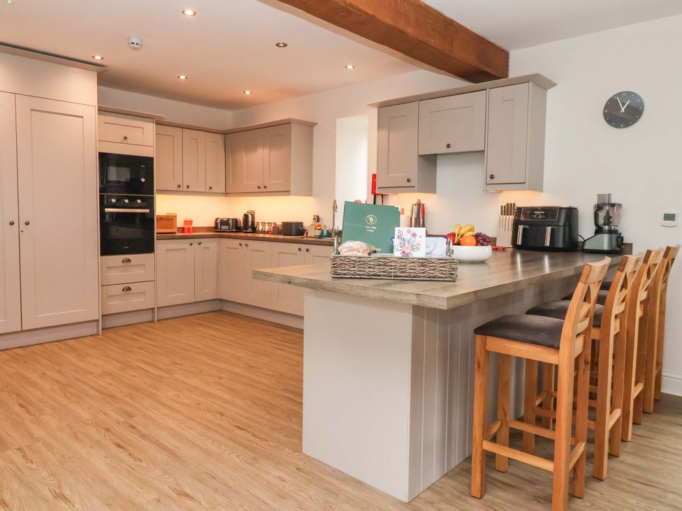 A kitchen with cabinets and appliances at Ploughman's Rigg Follifoot near Spofforth