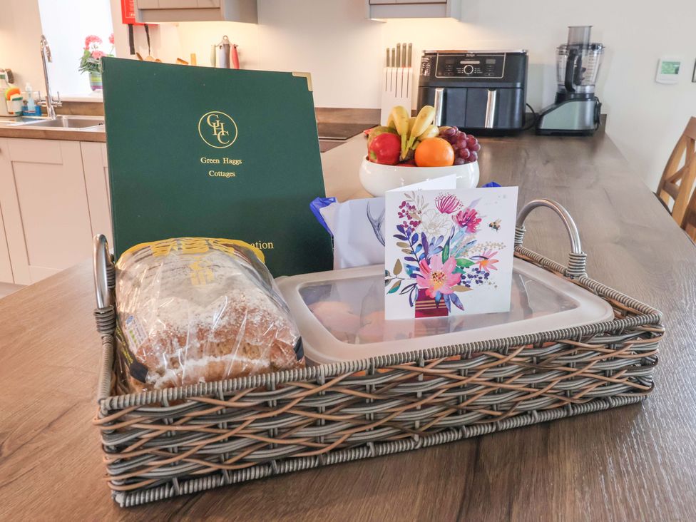 A kitchen countertop with a basket containing bread and a greeting card at Ploughman's Rigg Follifoot near Spofforth