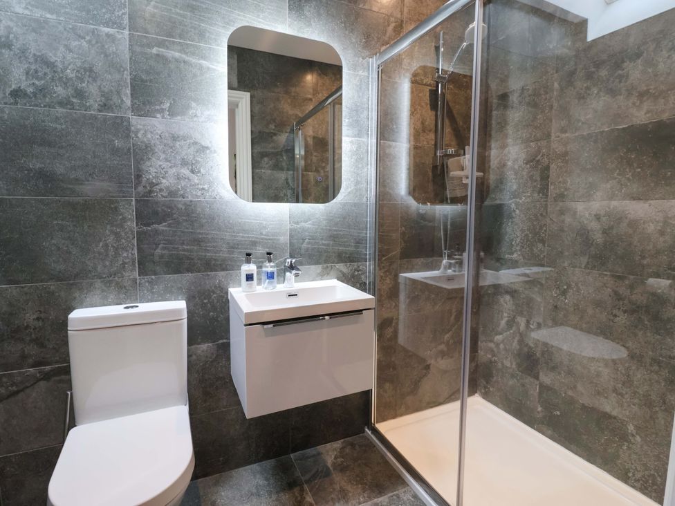 A bathroom with a shower and sink at Ploughman's Rigg Follifoot near Spofforth
