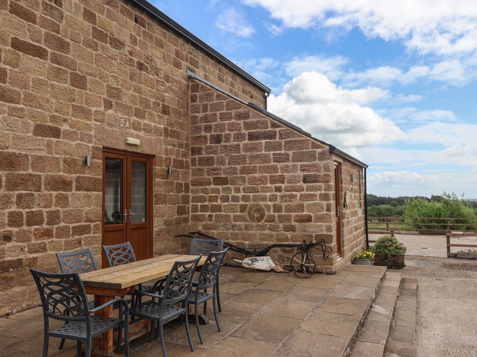 An outdoor area with a table and chairs at Ploughman's Rigg Follifoot near Spofforth