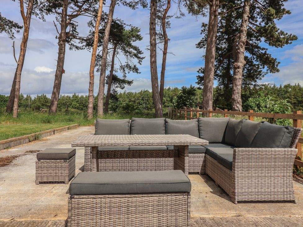 A sofa and table set in an outdoor area at Ploughman's Rigg in Follifoot near Spofforth