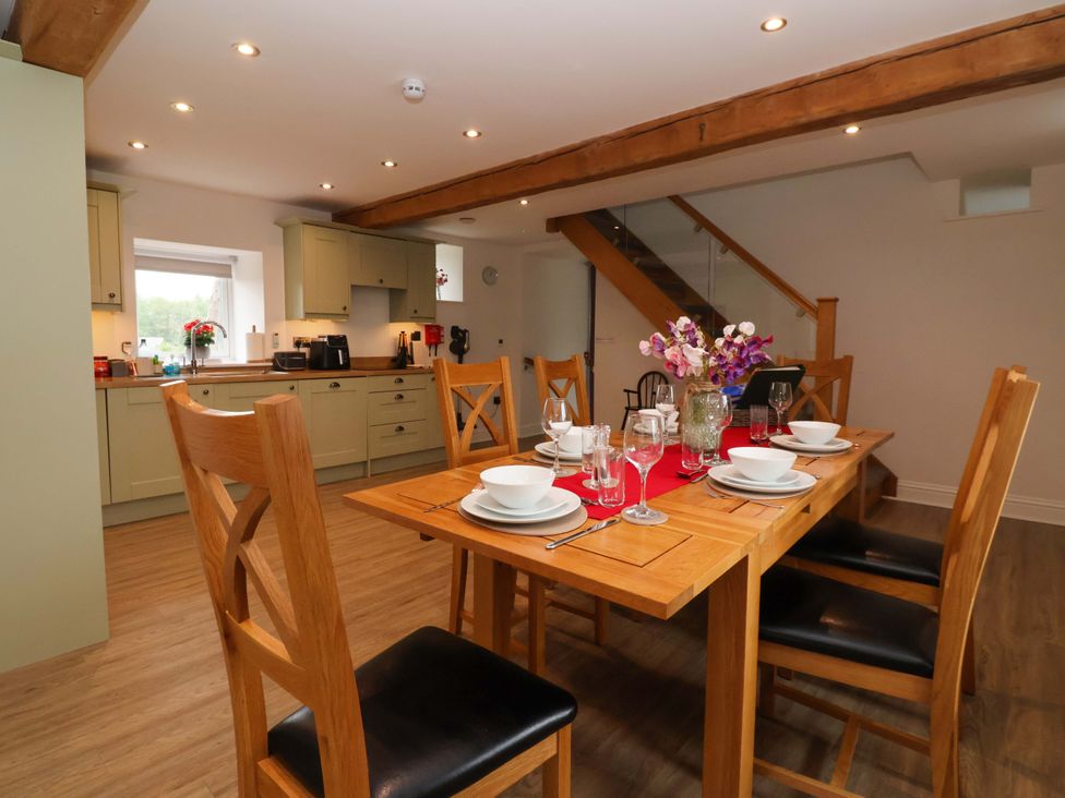 A dining room with a table set for a meal at Miller's Wheel in Spofforth