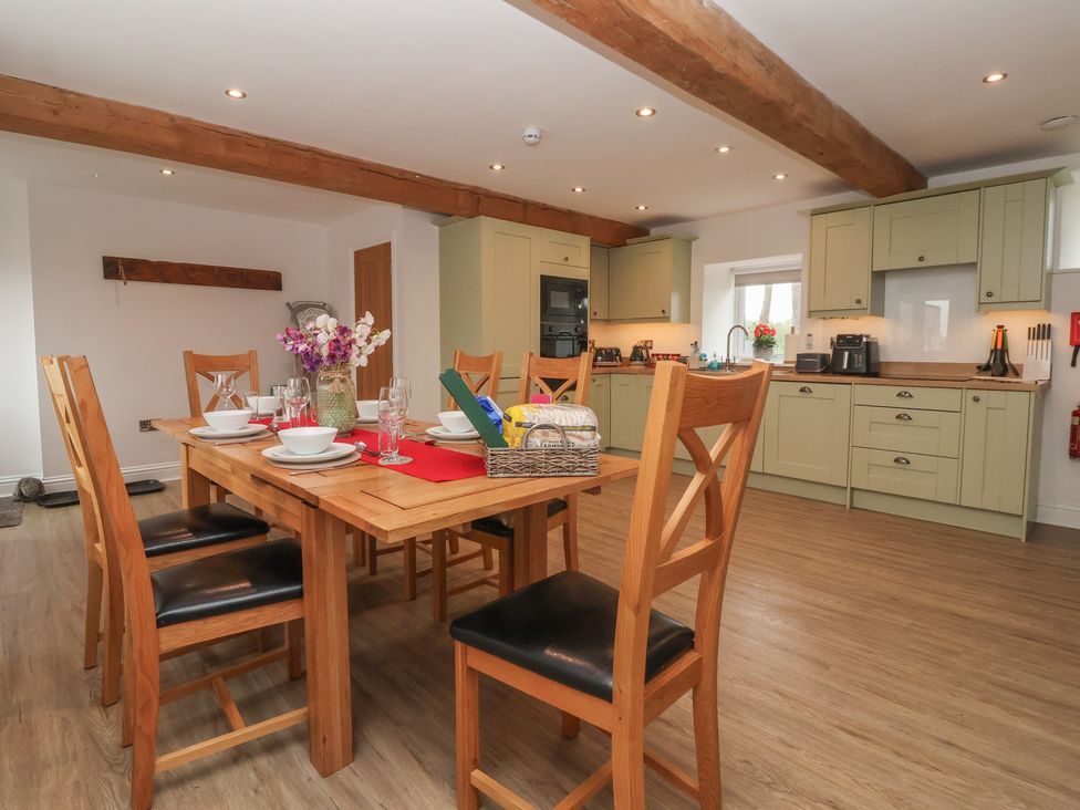 A kitchen with dining table and chairs at Miller's Wheel in Spofforth