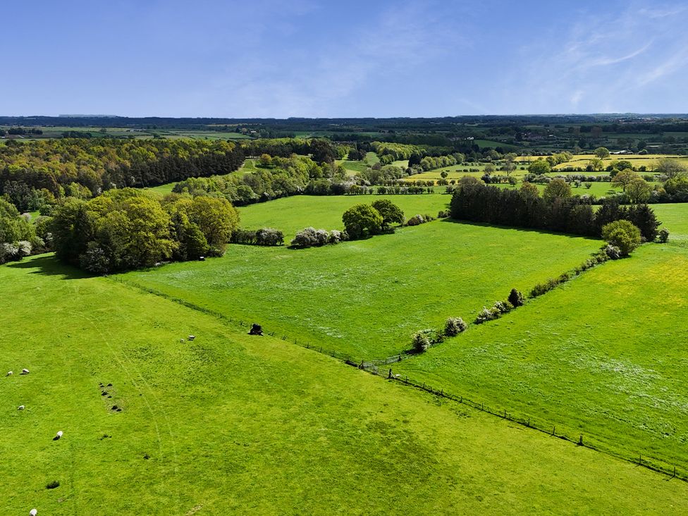 A scenic view of green fields and trees at Shepherd's Crook, Follifoot near Spofforth