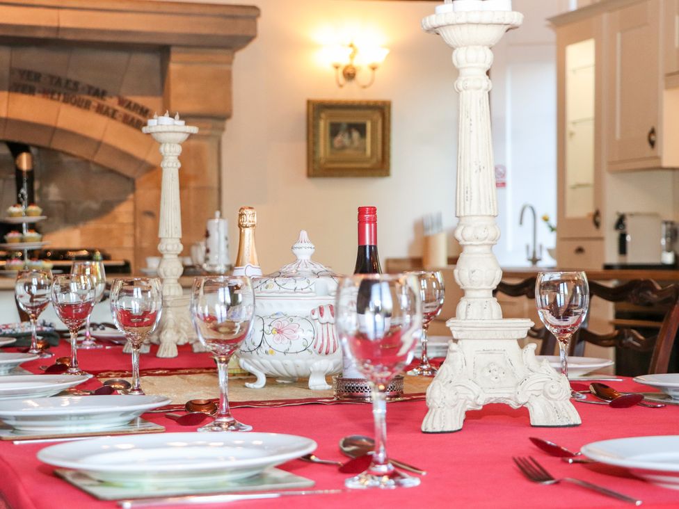 A dining room with a decorated table at Auchentroig House, Buchlyvie