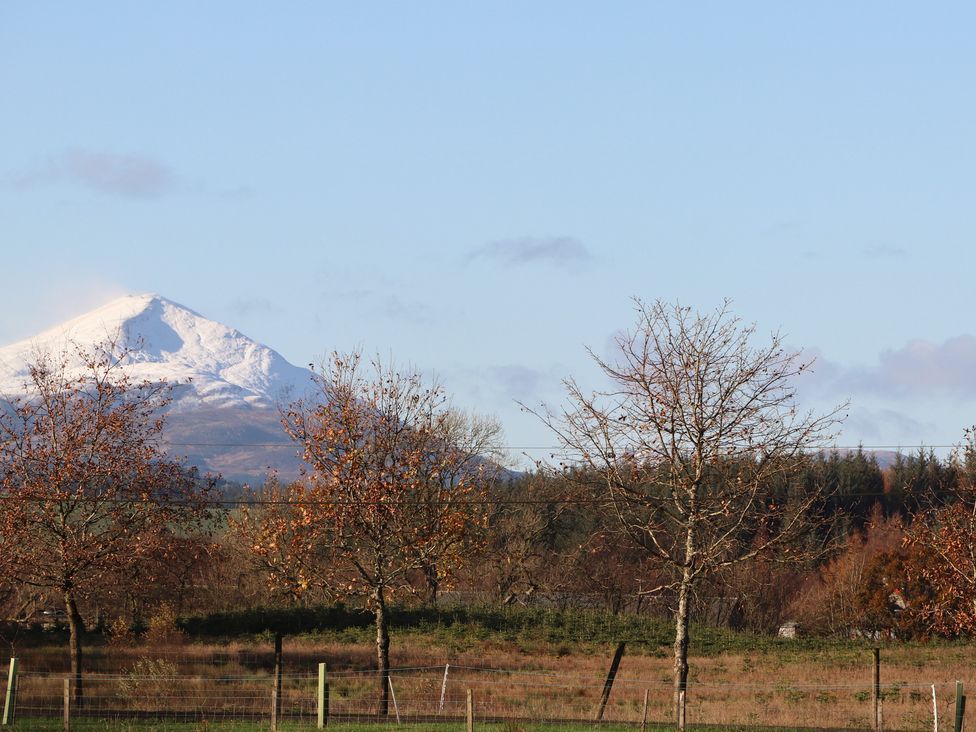 A mountain with snow and trees at Auchentroig House in Buchlyvie