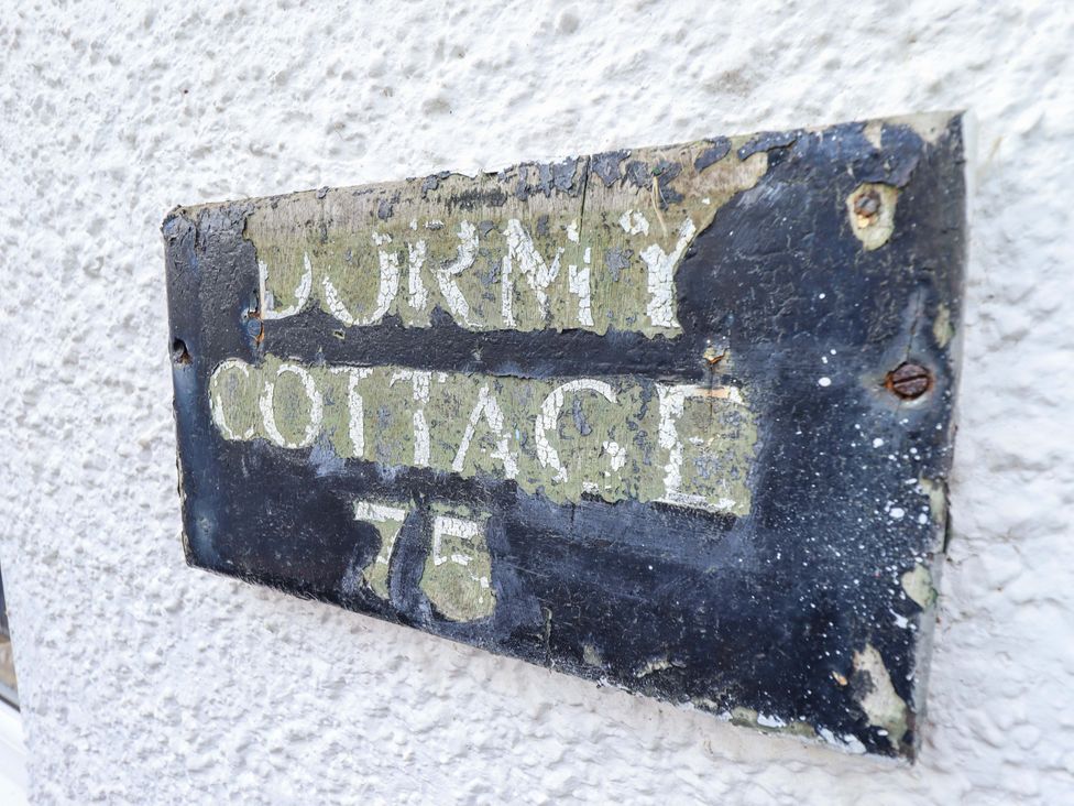 A sign displaying Dormy Cottage 76 located outdoors at Dormy Cottage Skegness