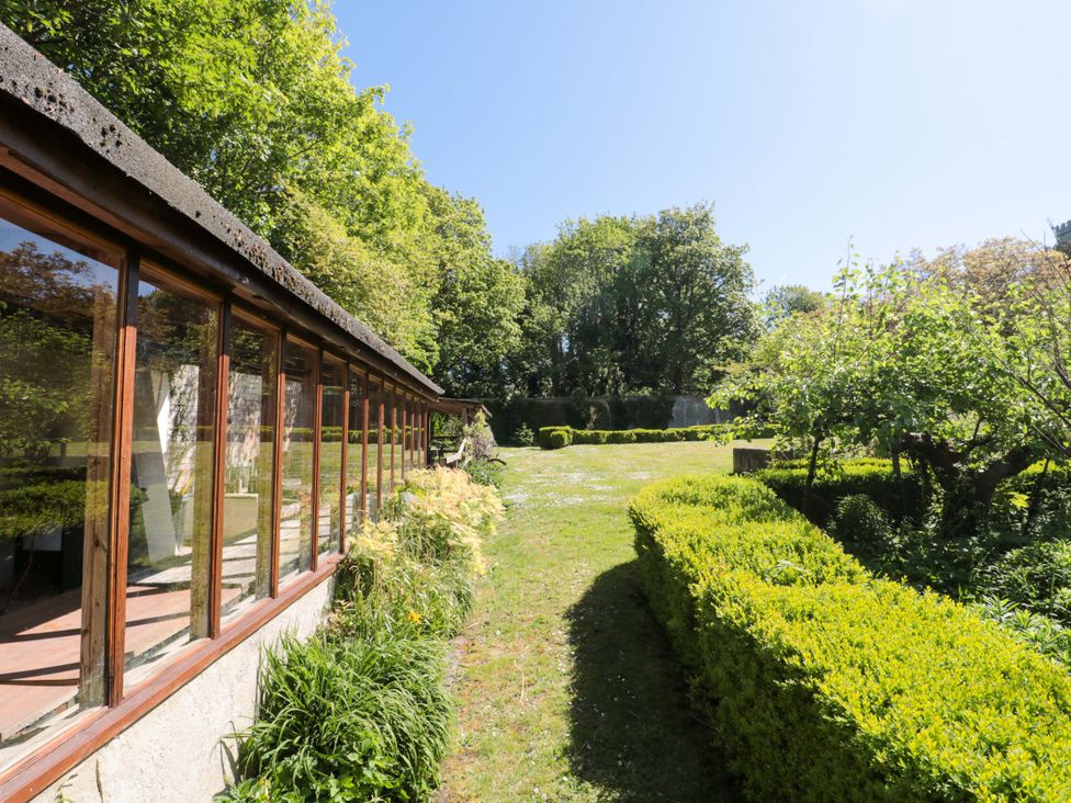 A garden with trees and bushes at The West Wing 