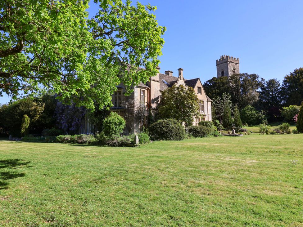 A house and tower in a garden at The West Wing 